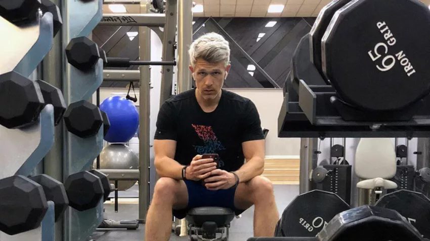 No fitness class: Nate Clark working out alone in a hotel gym in Texas.